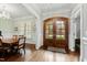 Foyer with hardwood floors and a view of the front door and dining room at 2635 Lakeview Dr, Raleigh, NC 27609