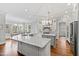 Gourmet kitchen features hardwood floors, white cabinets, granite countertops and stainless steel appliances at 2635 Lakeview Dr, Raleigh, NC 27609