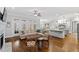 Open concept living room features hardwood floors, neutral colors, fireplace, and eat-in kitchen at 2635 Lakeview Dr, Raleigh, NC 27609