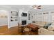 Living room boasts hardwood floors, built-in bookshelves, fireplace and an abundance of natural light at 2635 Lakeview Dr, Raleigh, NC 27609