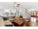 Open concept living room features hardwood floors, neutral colors, fireplace, eat-in kitchen and staircase at 2635 Lakeview Dr, Raleigh, NC 27609