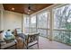Relaxing screened porch with comfortable seating and a ceiling fan at 2635 Lakeview Dr, Raleigh, NC 27609