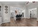Open-concept living space showcasing a stylish kitchen, bar seating, and an adjoining living room at 309 Old Farm Dr, Graham, NC 27253