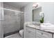 Bathroom showcasing a glass shower enclosure, granite countertops, and stylish fixtures at 3508 Cambridge Rd, Durham, NC 27707