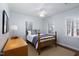 Inviting bedroom with a wooden bed frame, neutral tones, and ample natural light at 3508 Cambridge Rd, Durham, NC 27707