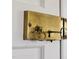 Close-up of an ornate, vintage brass door lock with a key, showcasing its unique and historical charm at 3508 Cambridge Rd, Durham, NC 27707