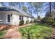 Charming home exterior with well-manicured lawn and a brick pathway leading to the entrance at 3508 Cambridge Rd, Durham, NC 27707