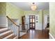Inviting foyer with hardwood floors, staircase and decorative chandelier at 3508 Cambridge Rd, Durham, NC 27707
