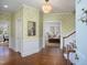 Welcoming foyer with hardwood floors, decorative chandelier, and an open view to the adjacent living space at 3508 Cambridge Rd, Durham, NC 27707
