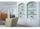 Living room with built-in shelves, providing ample storage and display space, enhancing the room's character at 3508 Cambridge Rd, Durham, NC 27707