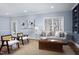 Bright living room featuring comfortable seating, stylish decor, and an abundance of natural light at 3508 Cambridge Rd, Durham, NC 27707