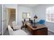 Bright home office with desk, chairs, and large windows at 3508 Cambridge Rd, Durham, NC 27707