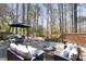 Outdoor patio with seating and a brick wall with planters at 3508 Cambridge Rd, Durham, NC 27707