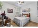 Cozy bedroom with carpet, wood headboard, soft lighting, and accent decor at 358 E Painted Way Way, Clayton, NC 27527