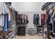 Walk-in closet with adjustable shelving, ample storage, and carpeted flooring at 358 E Painted Way Way, Clayton, NC 27527