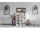 Neutral-toned entryway features decorative vases, mirror and shelving at 358 E Painted Way Way, Clayton, NC 27527