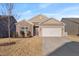 Inviting single-Gathering home features a spacious two-car garage and a stone and siding exterior at 358 E Painted Way Way, Clayton, NC 27527
