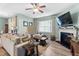 Stylish living room with fireplace, large sectional sofa and views of windows at 358 E Painted Way Way, Clayton, NC 27527