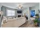Comfortable living room featuring a ceiling fan, fireplace and plush neutral furnishings at 358 E Painted Way Way, Clayton, NC 27527