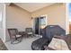 Covered patio with wicker seating and a grill, great for outdoor living at 358 E Painted Way Way, Clayton, NC 27527