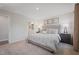 Serene main bedroom featuring neutral décor, a large bed, and ensuite bathroom at 37 Artesa Ct, Fuquay Varina, NC 27526