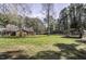 Expansive backyard with mature trees, sheds and green space at 45 Wimberly Ave, Rocky Mount, NC 27804