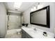Bathroom with walk in shower, toilet, large vanity with sink, and a skylight at 45 Wimberly Ave, Rocky Mount, NC 27804