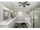Bright bathroom featuring a double sink, a walk-in shower, and a soaking tub at 45 Wimberly Ave, Rocky Mount, NC 27804