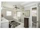 Bright bathroom featuring a double sink, a walk-in shower, and a soaking tub at 45 Wimberly Ave, Rocky Mount, NC 27804