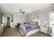 Spacious bedroom featuring neutral colors, a ceiling fan, and a large bed at 45 Wimberly Ave, Rocky Mount, NC 27804
