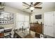Bedroom with a ceiling fan, a window, a mounted TV, and a wooden desk at 45 Wimberly Ave, Rocky Mount, NC 27804