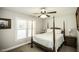 Bedroom with four poster bed, window, two side tables and neutral colored walls at 45 Wimberly Ave, Rocky Mount, NC 27804