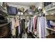 Walk in closet with shelving and hanging racks filled with various folded and hanging clothes at 45 Wimberly Ave, Rocky Mount, NC 27804