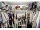 Walk-in closet featuring clothing racks, shelves, storage bins, and plenty of personal belongings at 45 Wimberly Ave, Rocky Mount, NC 27804