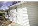Garage featuring double doors and an exterior light fixture at 45 Wimberly Ave, Rocky Mount, NC 27804