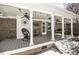 Covered porch with columns, ceiling fans, and comfortable seating at 45 Wimberly Ave, Rocky Mount, NC 27804