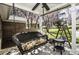 Relaxing porch swing with decorative cushions and outdoor table at 45 Wimberly Ave, Rocky Mount, NC 27804