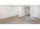 Spacious finished basement featuring neutral walls, plush carpeting, and multiple entryways at 464 Longfellow St, Fuquay Varina, NC 27526