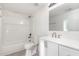 Bright bathroom featuring a shower/tub combo, sleek white vanity, and modern fixtures at 464 Longfellow St, Fuquay Varina, NC 27526