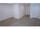Carpeted bedroom featuring white walls, recessed lighting and two white doors at 464 Longfellow St, Fuquay Varina, NC 27526