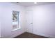 Bedroom featuring neutral carpet, white walls, a bright window and a door at 464 Longfellow St, Fuquay Varina, NC 27526