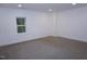 Bedroom featuring neutral carpet, white walls, and a single window with a view of the outside at 464 Longfellow St, Fuquay Varina, NC 27526