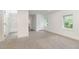 Expansive bedroom with carpet, multiple windows, and doorway to an ensuite bathroom at 464 Longfellow St, Fuquay Varina, NC 27526