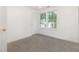 Bright, carpeted bedroom featuring two windows letting in ample natural light at 464 Longfellow St, Fuquay Varina, NC 27526