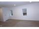 Bedroom with neutral carpet, white walls, recessed lighting, and two windows providing natural light at 464 Longfellow St, Fuquay Varina, NC 27526