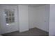 Cozy bedroom featuring neutral carpet, white walls, and a bright window at 464 Longfellow St, Fuquay Varina, NC 27526