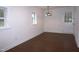 Dining room area with wood flooring, a vintage light fixture and a door to the outside at 464 Longfellow St, Fuquay Varina, NC 27526