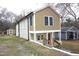 Charming two-story home featuring unique architecture and manicured landscaping at 464 Longfellow St, Fuquay Varina, NC 27526