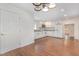 Modern kitchen with white cabinets, granite countertops, and stainless steel appliances at 464 Longfellow St, Fuquay Varina, NC 27526