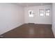 Bright and airy living room featuring hardwood floors and plenty of natural light at 464 Longfellow St, Fuquay Varina, NC 27526